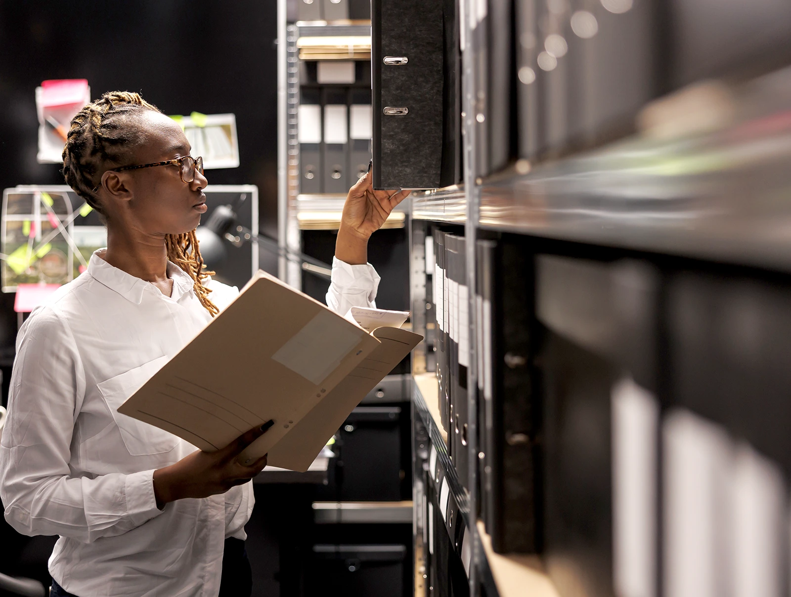 Long term storage, lady looking at some folders